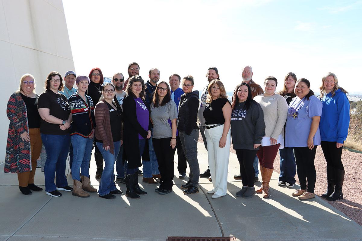 LAMI Cohort, group of individuals from San Juan College throughout various departments standing together outside.